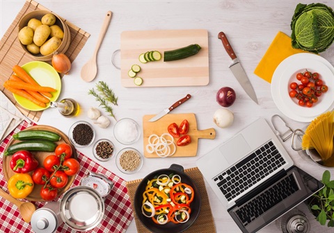 stock-photo-creative-vegetarian-kitchen-with-cooking-utensils-fresh-vegetables-and-laptop-on-a-wooden-table-267766175-Online-Food-trainig-Trial.jpg